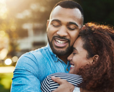 Shot of a happy young couple embracing in the park