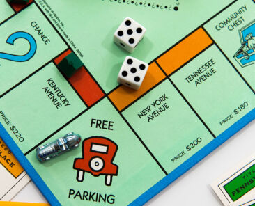 Houston, TX, USA - November 1, 2014: Monopoly board game - car on Free Parking and dice